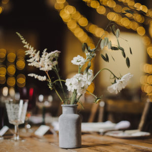 Bottles of wild flowers centrepieces
