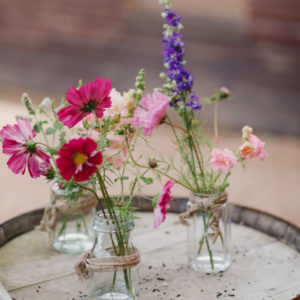 Bright summer flowers in jars